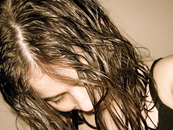 Why You Should Avoid Sleeping With Wet Hair
